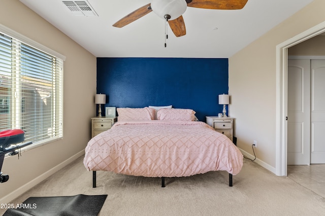 carpeted bedroom with ceiling fan