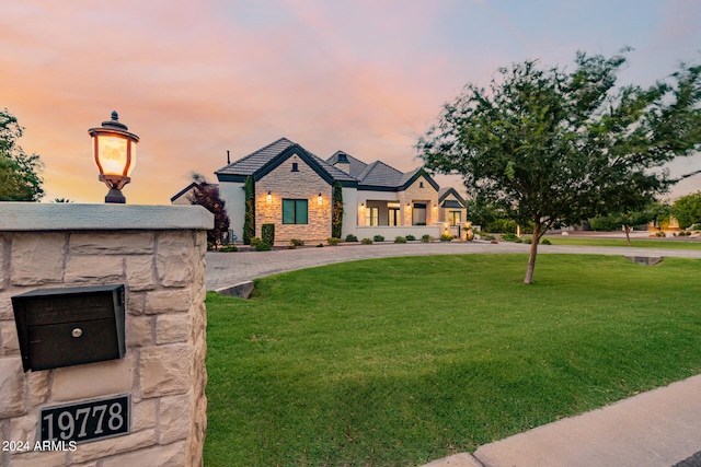 view of front of home featuring a yard