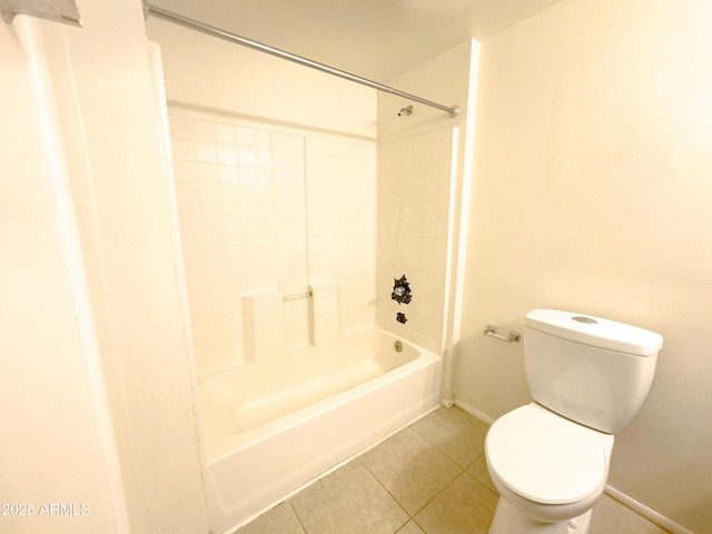 bathroom featuring toilet, tile patterned flooring, and shower / bath combination