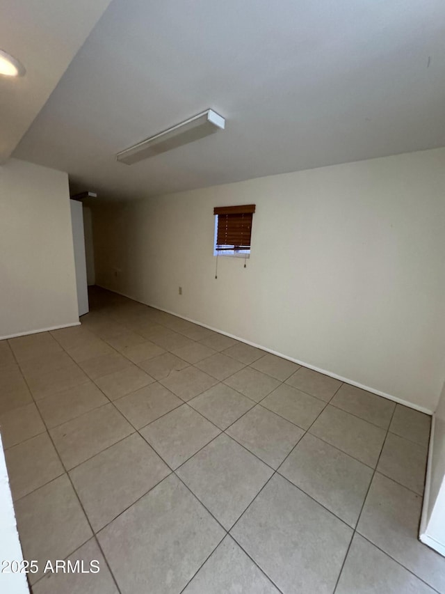 unfurnished room featuring light tile patterned floors