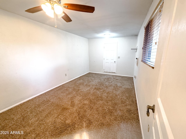 empty room featuring carpet floors and ceiling fan