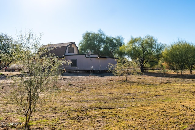 view of yard with a rural view