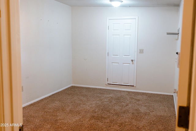 unfurnished room with carpet flooring