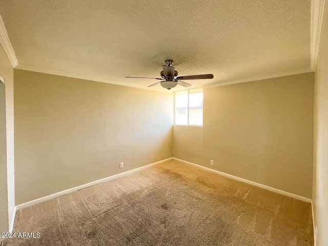 carpeted spare room featuring crown molding, a textured ceiling, and ceiling fan