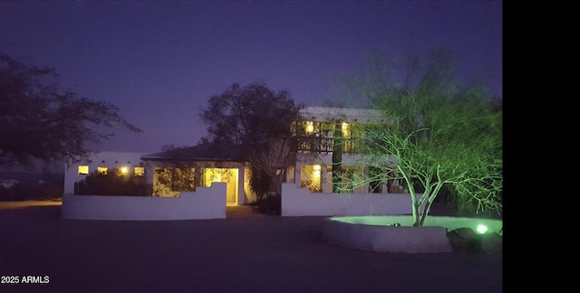 view of property exterior at twilight