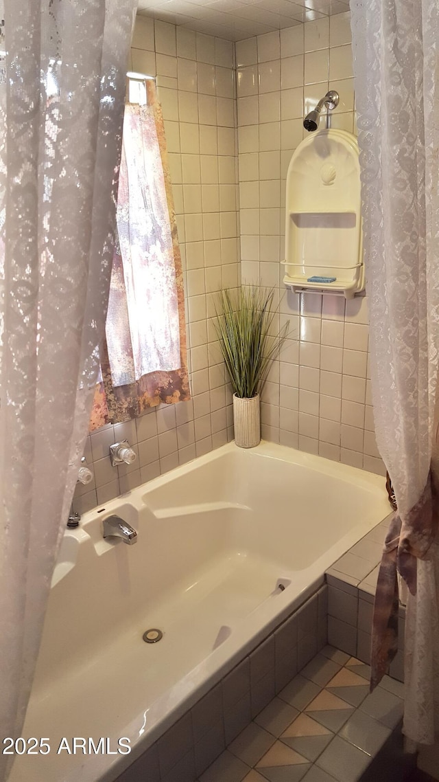 full bath featuring shower / bath combination with curtain and tile patterned flooring