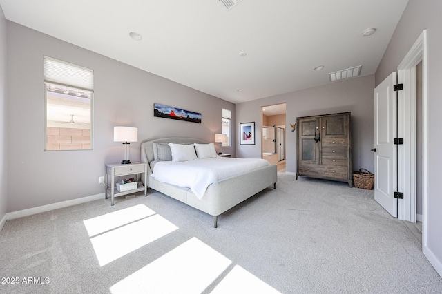 bedroom with light carpet, visible vents, and baseboards