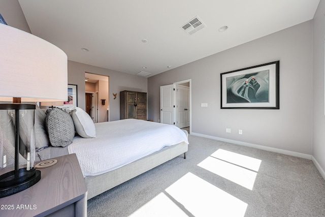 carpeted bedroom with baseboards and visible vents