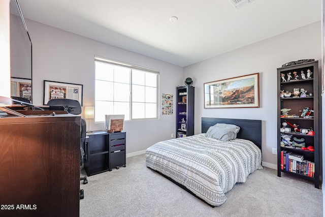 carpeted bedroom with baseboards