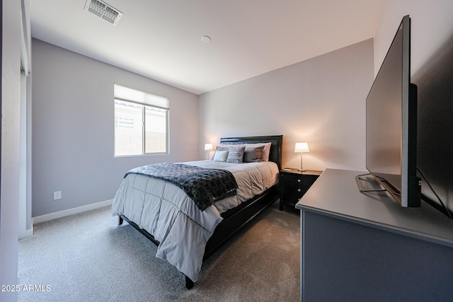 carpeted bedroom featuring visible vents and baseboards