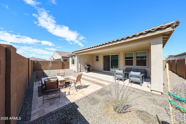 view of patio / terrace with an outdoor living space with a fire pit, area for grilling, and a fenced backyard