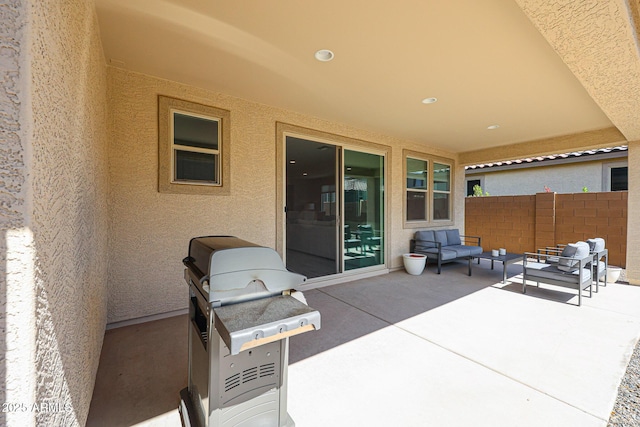 view of patio featuring outdoor lounge area and fence