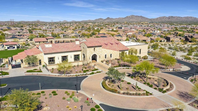 birds eye view of property with a mountain view and a residential view