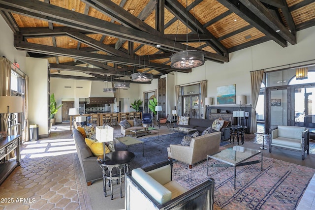 living room with beamed ceiling, high vaulted ceiling, and wood ceiling