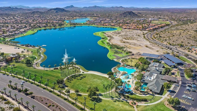 drone / aerial view with a water and mountain view