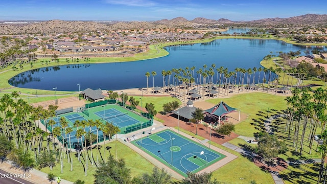 birds eye view of property featuring a water and mountain view