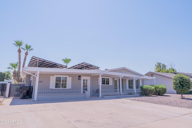 ranch-style home featuring a porch