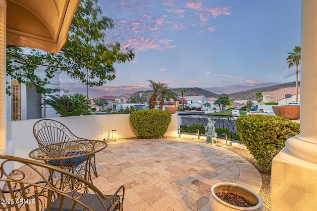 21474 N 56th Ave, Glendale, AZ 85308 - patio terrace at dusk featuring a mountain view