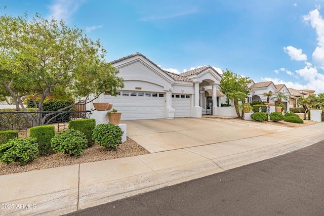 21474 N 56th Ave, Glendale, AZ 85308 - view of front facade with a tiled roof, stucco siding, fence, a garage, and driveway