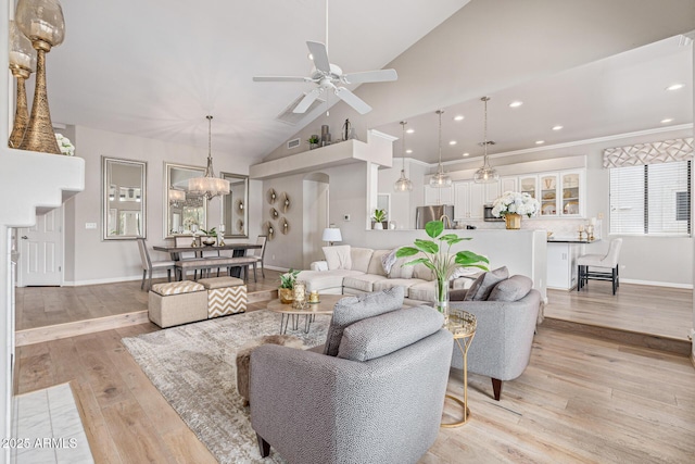 21474 N 56th Ave, Glendale, AZ 85308 - living area featuring baseboards, light wood-style floors, recessed lighting, ceiling fan with notable chandelier, and high vaulted ceiling