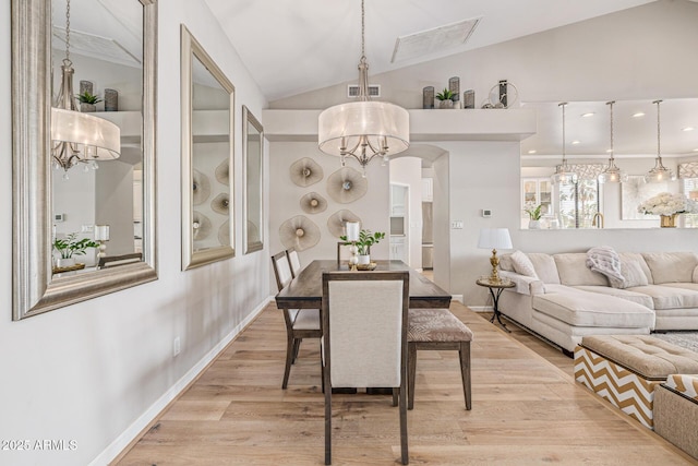 21474 N 56th Ave, Glendale, AZ 85308 - dining space with an inviting chandelier, light wood-style flooring, visible vents, lofted ceiling, and baseboards