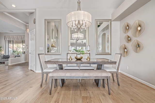 21474 N 56th Ave, Glendale, AZ 85308 - dining space with a chandelier, light wood-type flooring, and baseboards