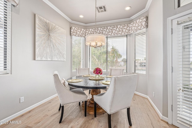21474 N 56th Ave, Glendale, AZ 85308 - dining area featuring a chandelier, a healthy amount of sunlight, ornamental molding, and visible vents