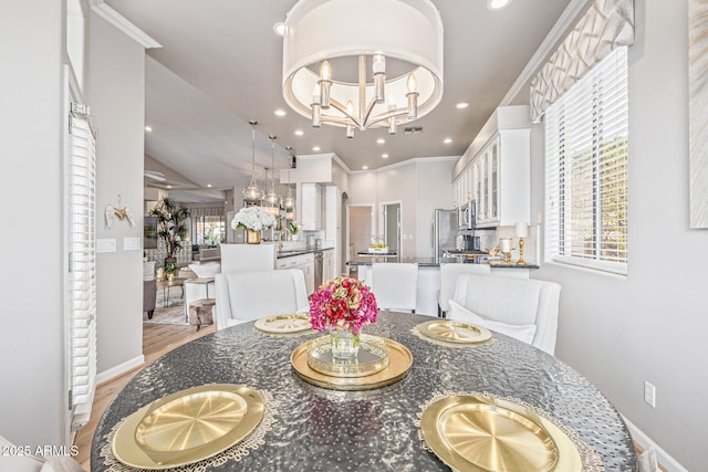 21474 N 56th Ave, Glendale, AZ 85308 - dining space featuring a chandelier, light wood-type flooring, crown molding, and recessed lighting