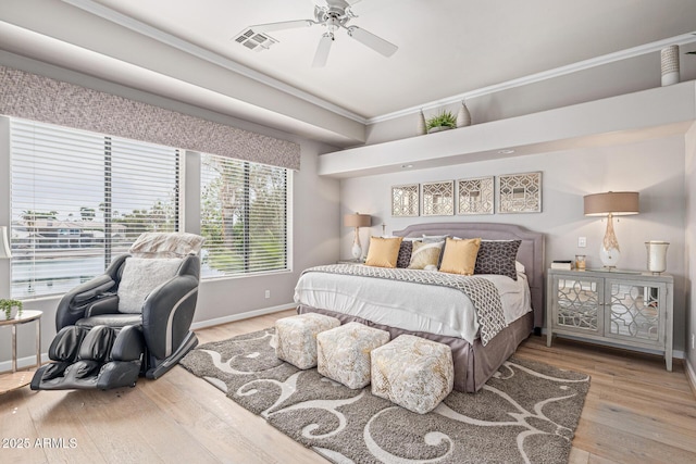 21474 N 56th Ave, Glendale, AZ 85308 - bedroom with visible vents, baseboards, ornamental molding, a ceiling fan, and hardwood / wood-style floors