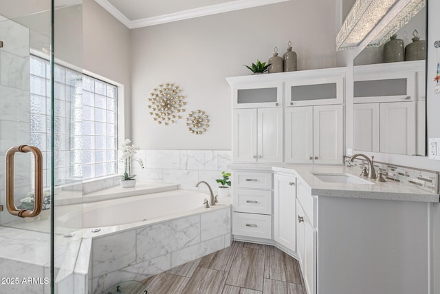 21474 N 56th Ave, Glendale, AZ 85308 - bathroom with crown molding, a garden tub, vanity, and a shower with shower door