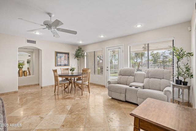 21474 N 56th Ave, Glendale, AZ 85308 - dining space featuring visible vents, baseboards, arched walkways, ceiling fan, and recessed lighting
