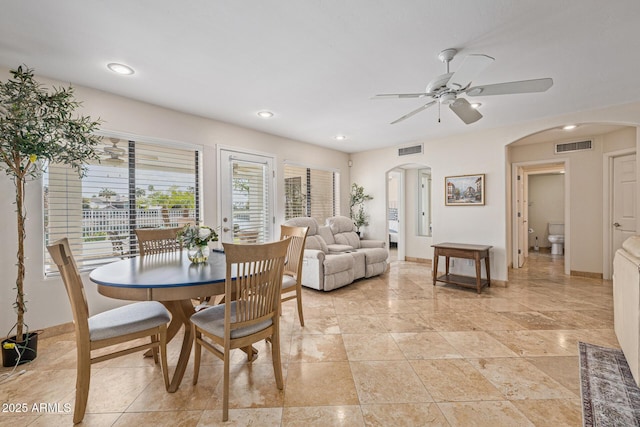 21474 N 56th Ave, Glendale, AZ 85308 - dining area featuring arched walkways, visible vents, baseboards, and a ceiling fan