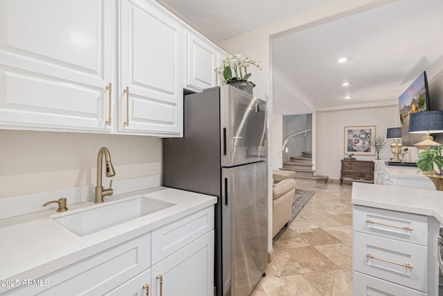 21474 N 56th Ave, Glendale, AZ 85308 - kitchen with recessed lighting, light countertops, freestanding refrigerator, white cabinets, and a sink