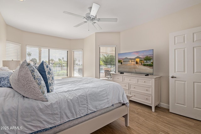 21474 N 56th Ave, Glendale, AZ 85308 - bedroom featuring ceiling fan, light wood-type flooring, and baseboards
