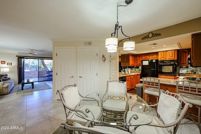 dining area featuring sink, ceiling fan, light tile floors, and ornamental molding