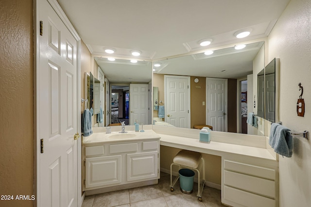 bathroom with tile floors and large vanity