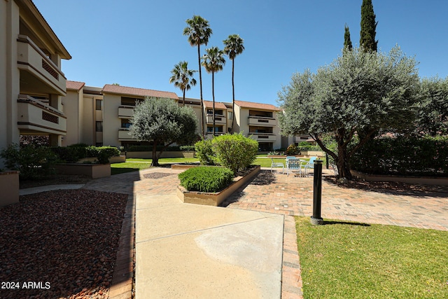 view of home's community with a lawn