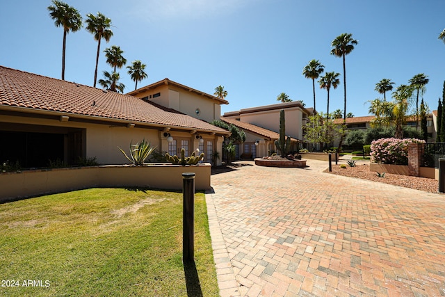 view of property exterior with a lawn