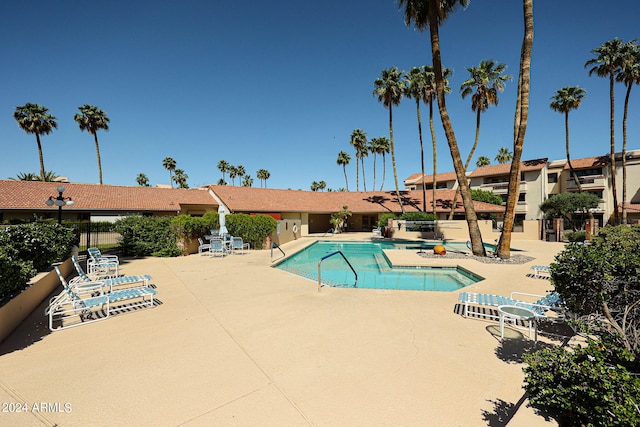 view of swimming pool featuring a patio area