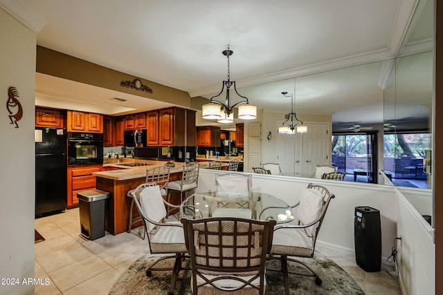 dining room with ceiling fan with notable chandelier, ornamental molding, and light tile flooring