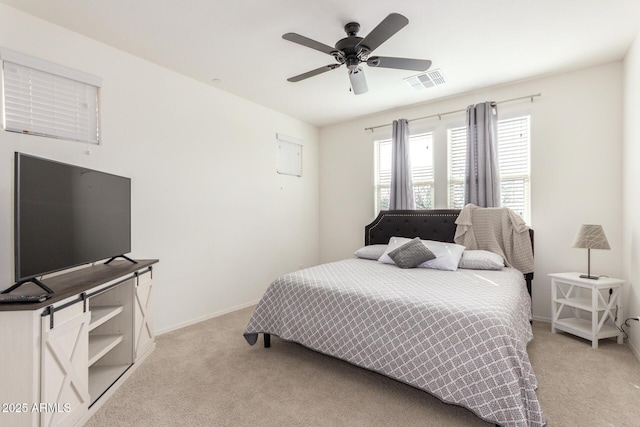 bedroom with light carpet, baseboards, visible vents, and a ceiling fan