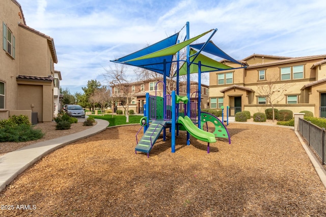 community jungle gym with a residential view