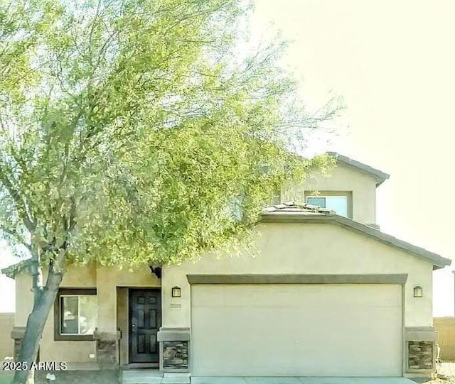 22523 W Pima St, Buckeye, AZ 85326 - view of front of property featuring driveway and stucco siding
