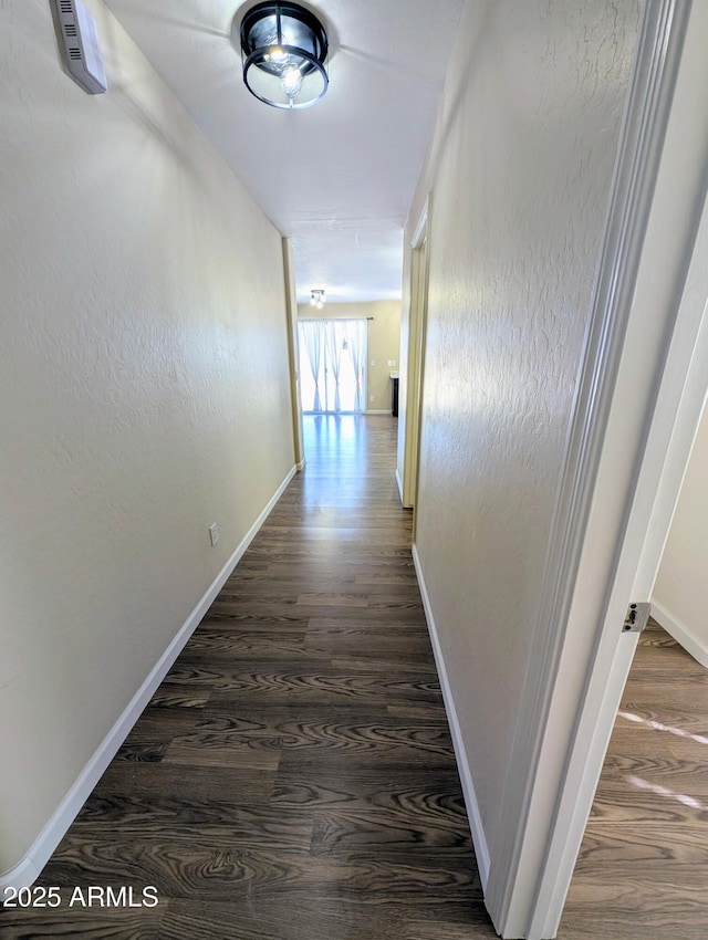 22523 W Pima St, Buckeye, AZ 85326 - hall with dark wood-type flooring and baseboards