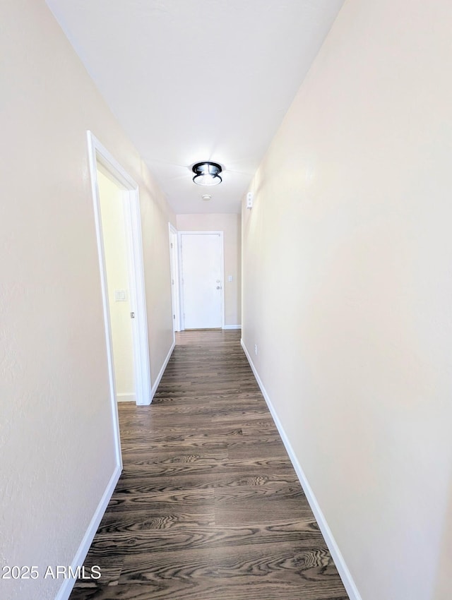 22523 W Pima St, Buckeye, AZ 85326 - corridor featuring baseboards and dark wood finished floors