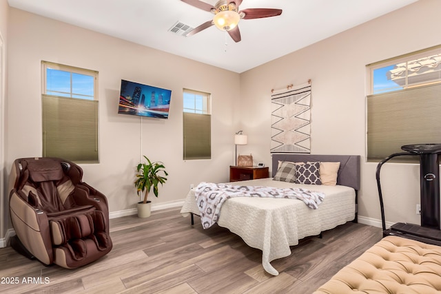 bedroom featuring wood-type flooring and ceiling fan