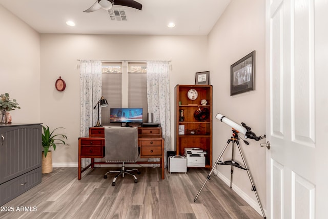 office featuring hardwood / wood-style floors and ceiling fan