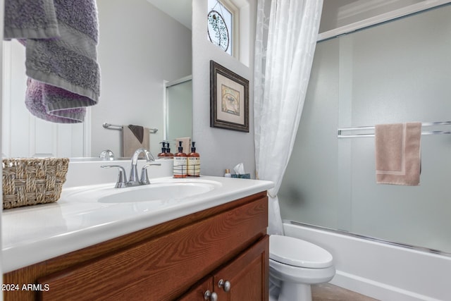 full bathroom with vanity, toilet, and shower / bath combo