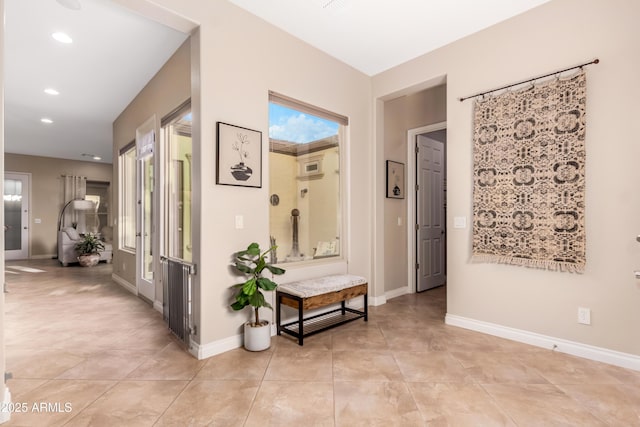 hallway with light tile patterned floors