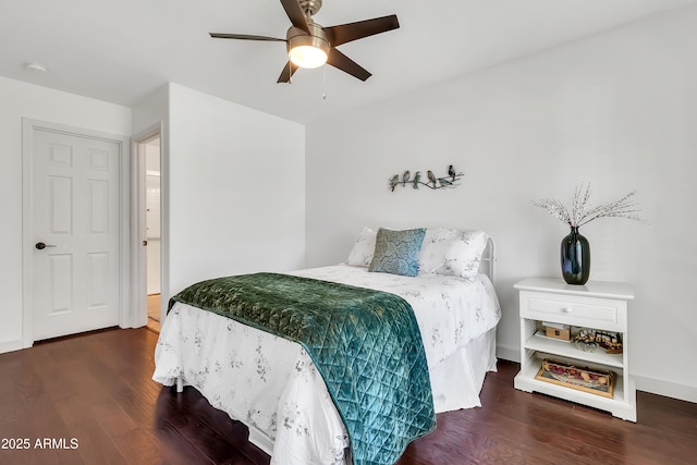 21167 E Aspen Valley Dr, Queen Creek, AZ 85142 - bedroom with wood finished floors, a ceiling fan, and baseboards